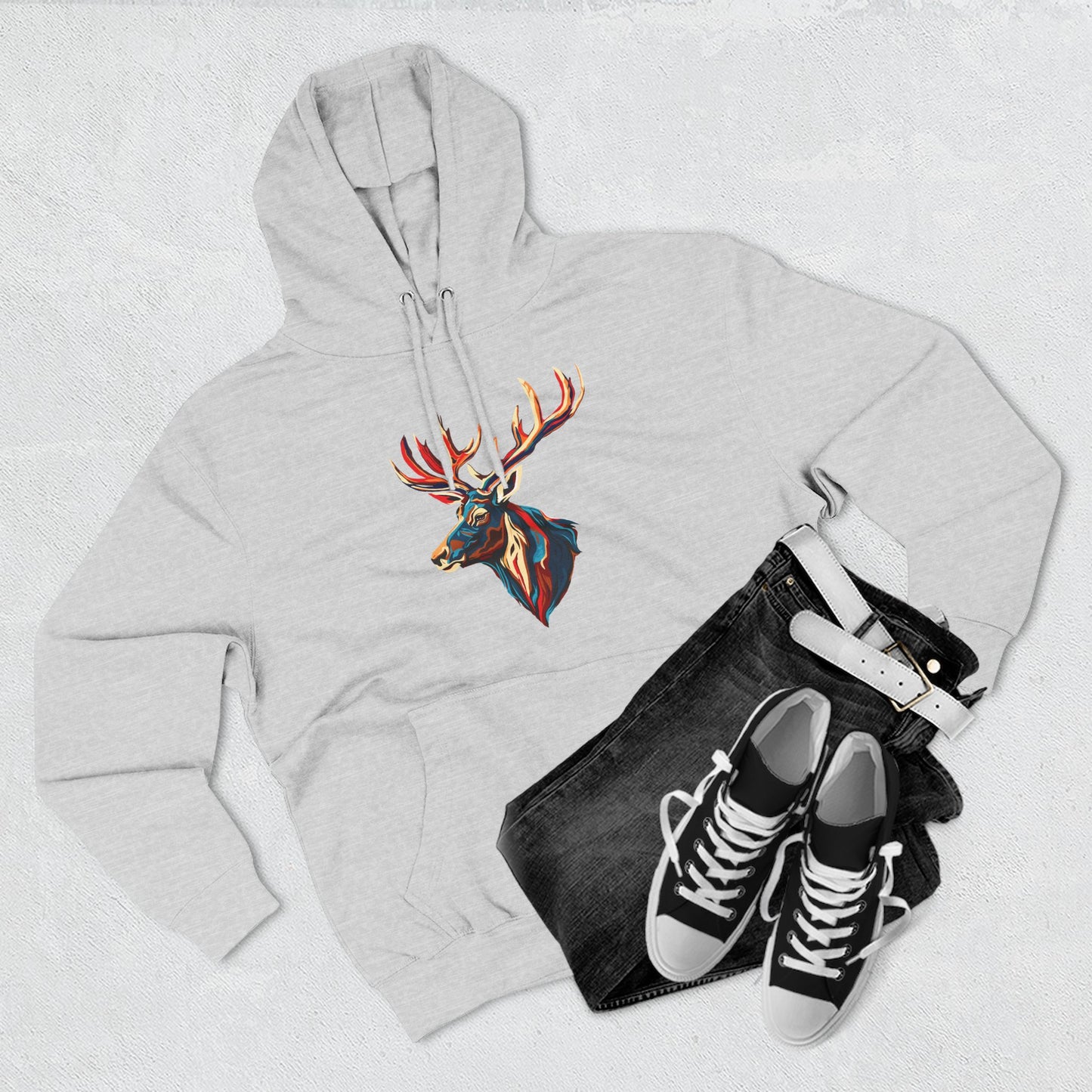 Hand-drawn Alaska Native inspired elk hoodie — original Indigenous wildlife design — flat lay view