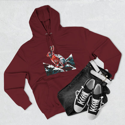Hand-drawn Alaska Native inspired snowshoe hare hoodie — original Indigenous wildlife design — flat lay view
