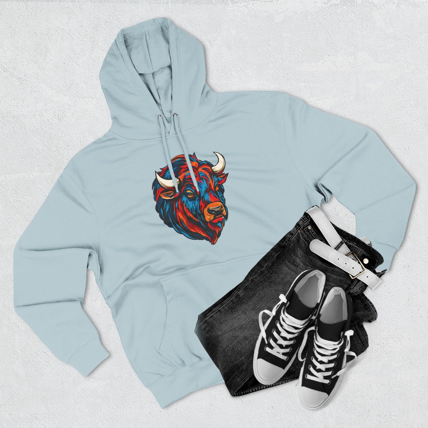 Hand-drawn Alaska Native inspired bison hoodie — original Indigenous wildlife design — flat lay view