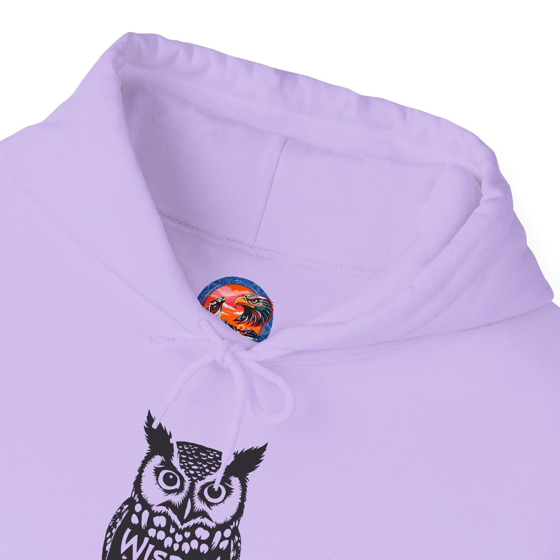Hand-drawn 'Wisdom' word art hoodie inspired by Alaska Native design traditions — close-up of the design detail