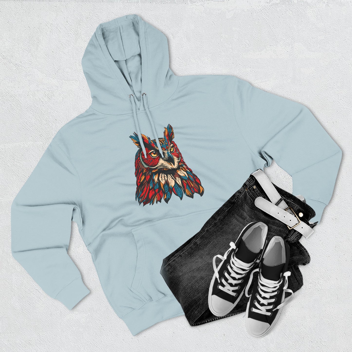 Hand-drawn Alaska Native inspired great horned owl hoodie — original Indigenous wildlife design — flat lay view