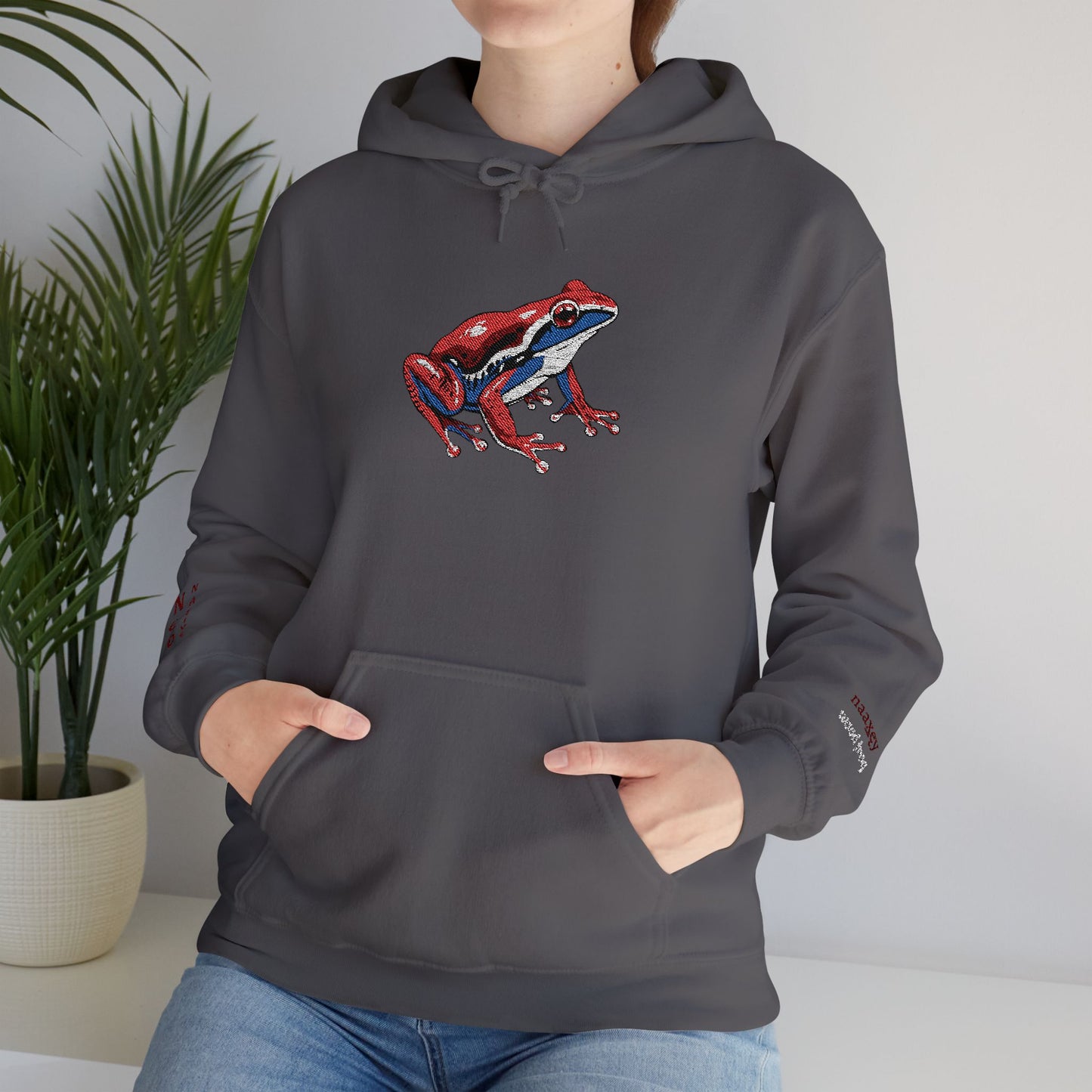 Hand-drawn Alaska Native inspired wood frog hoodie — original Indigenous wildlife design — close-up texture detail